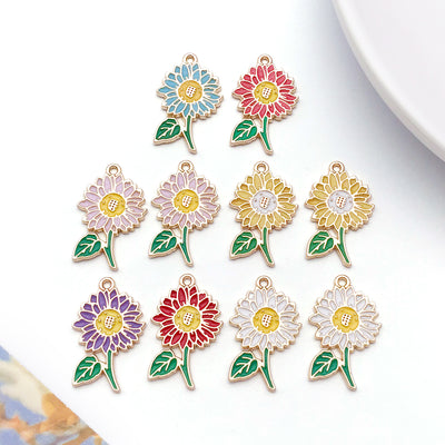 Colorful sunflower charms arranged on a light background
