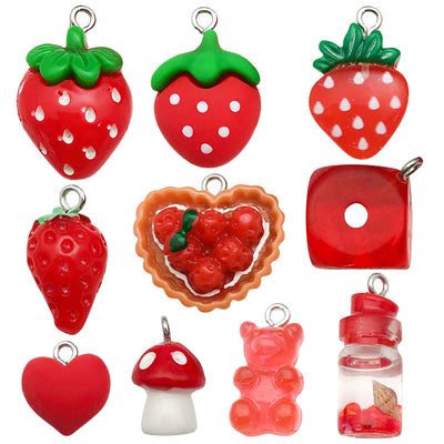 Red strawberry and heart charms pictured with visible surface details