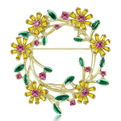 Front view of round leafy wreath dotted with small flowers