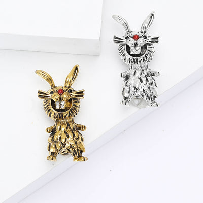 Product image 1 showing the textured rabbit brooch with red eyes in silver or gold.