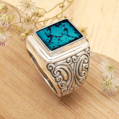 Front product view of the wide signet ring with a square turquoise color top and scroll sides