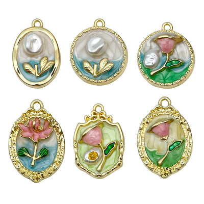 Gold-tone assorted shape charms arranged on a light background