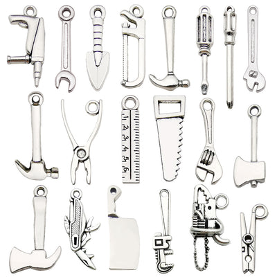 Metallic assorted shape charms arranged on a light background