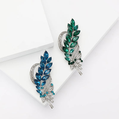 Wheat Leaf Peacock Brooch front view on a plain background