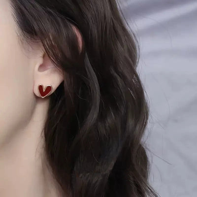 Front view of small red enamel heart studs