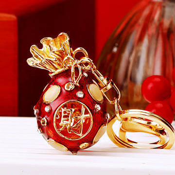 Jeweled Fortune Bag Keychain With Gold Tone Leaf Top