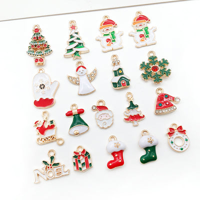 Colorful christmas tree charms arranged on a light background