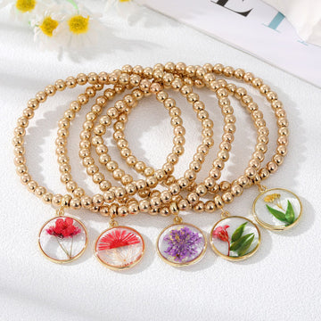 Gold Tone Beaded Bracelets with Clear Pressed Flower Charms