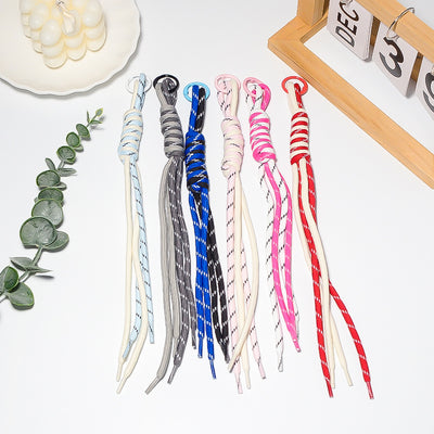 Six braided stripe cord tassel keychains in assorted colors