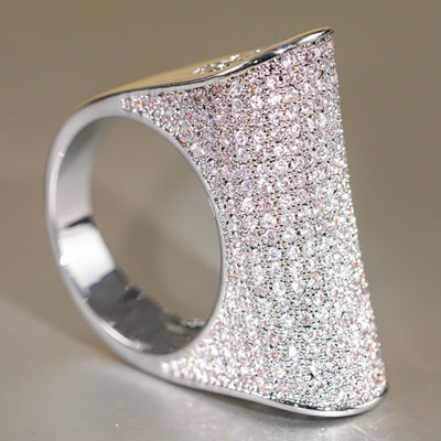 White gold angled full pave dome ring side profile studio shot