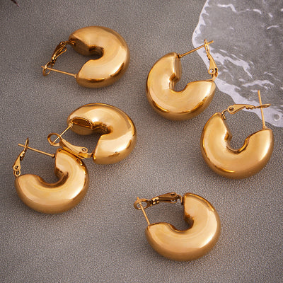 Display view of thick hollow C hoop earrings in main image 1.