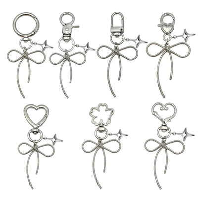 Image 1 showing a set of four metal key chains.