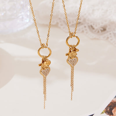 Two gold key-ring pendant necklaces with zircon hearts and chain tassels