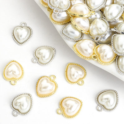 Front assortment of heart-shaped faux pearls framed by crystal-trimmed metal