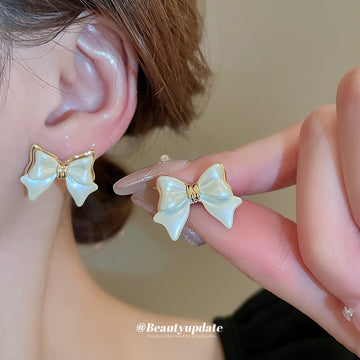 White Enamel Bow Stud Earrings With Gold Tone Edges