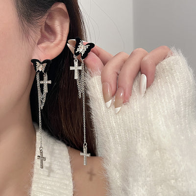 Primary supplied view of butterfly cross-chain and flower stud earrings