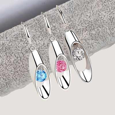 Front view of oval openwork drop earrings with three crystal colors