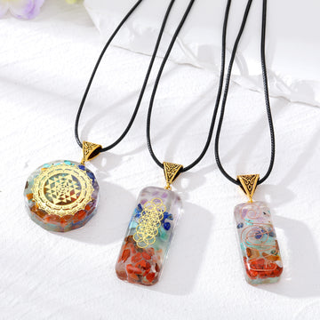 Antique Gold Tone Patterned Resin Pendants on Black Cords