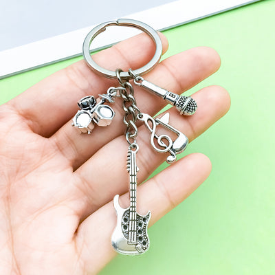 Image 1 showing a hand holding two keys.