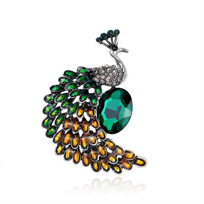 Front product view of the peacock brooch pin in silver and black