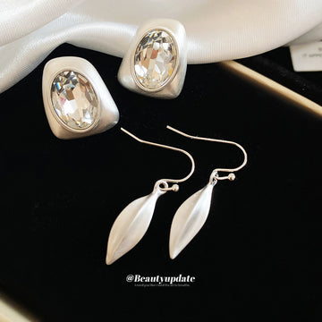 Silver Abstract Teardrop Earrings In Hook And Stud Styles
