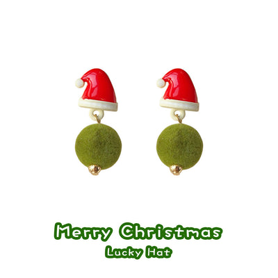 Red Santa hat studs with green pom drops on white background