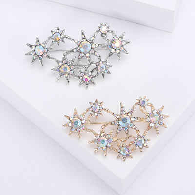 Front view of crystal star cluster brooch in gold tone and silver tone