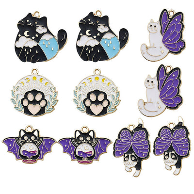 Colorful butterfly and cat charms arranged on a light background