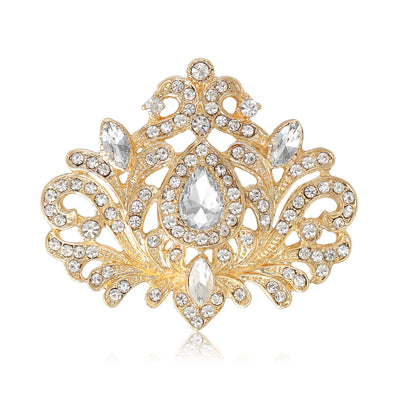 Product display showing a symmetrical filigree crest with clear teardrop and round crystals