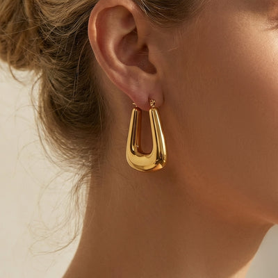 Display view of tapered open center hoop earrings in main image 1.