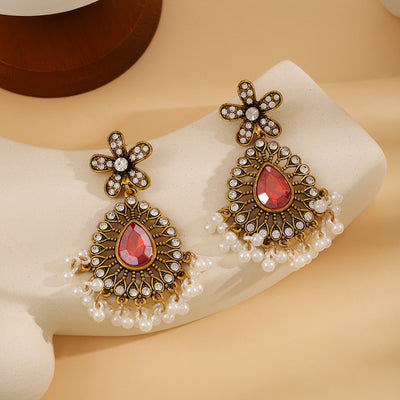 Primary supplied view of red teardrop pearl-fringe studs