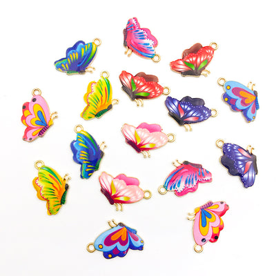 Colorful butterfly keychains arranged on a light background