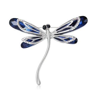 Front view of the glass wing dragonfly brooch in green or blue with polished metal detail on a white background