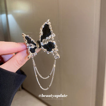 Black Butterfly Brooch With Silver Tone Edges And Draped Chains