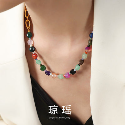 Multicolor agate bead necklace worn with white blazer