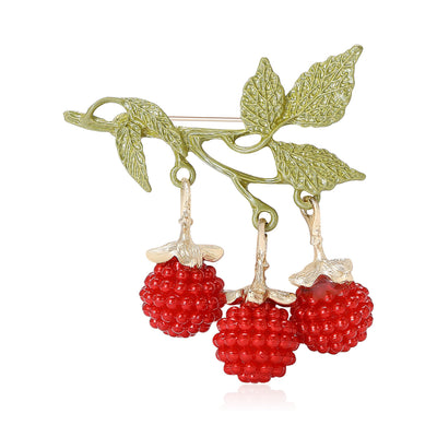 Red raspberry drop brooch on green enamel branch front view