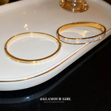 Gold Tone Hinged Bangle With Triple Rows Of Clear Crystals