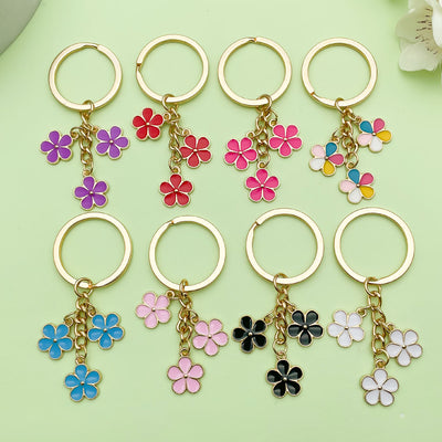 Image 1 showing 6pcs / lot flower keychain.