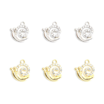 Crystal Snail Alloy Charm Pendants arranged on a white background