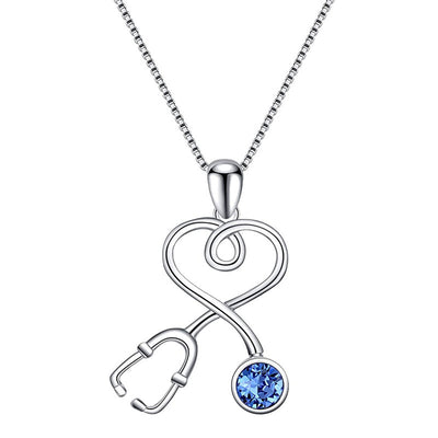 White metal stethoscope heart blue stone pendant on white background