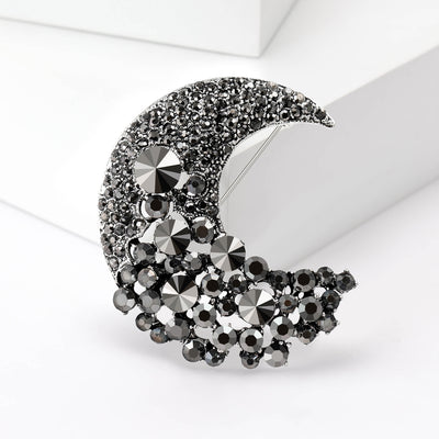 Black gunmetal rhinestone crescent moon brooch front on white