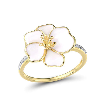 Gold white enamel five-petal flower ring angled on white background