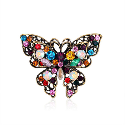Front product view of the butterfly brooch pin in gold and black