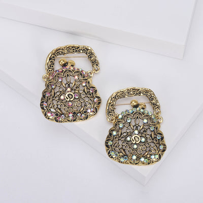 Front view of openwork handbag brooch with pastel crystal accents