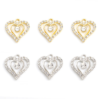 Assorted heart charms arranged on a white surface