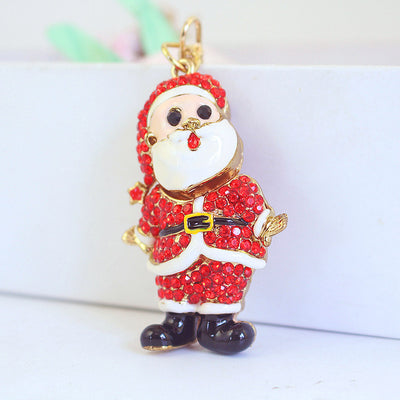 Close-up front view of a red rhinestone Santa figure with a white beard and black boots.