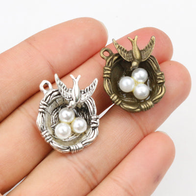 Bird Nest Pearl Charms arranged in the pictured color and finish options