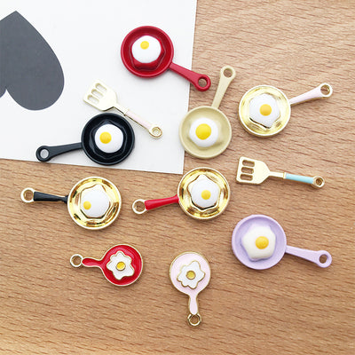 Colorful assorted shape charms arranged on a light background