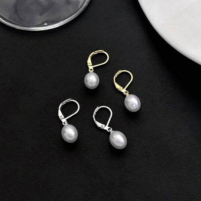 Primary supplied view of pearl-look drop huggie earrings
