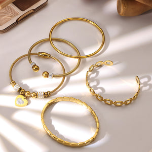 Heart Crystal and Geometric Bangle Collection in Two Metal Tones